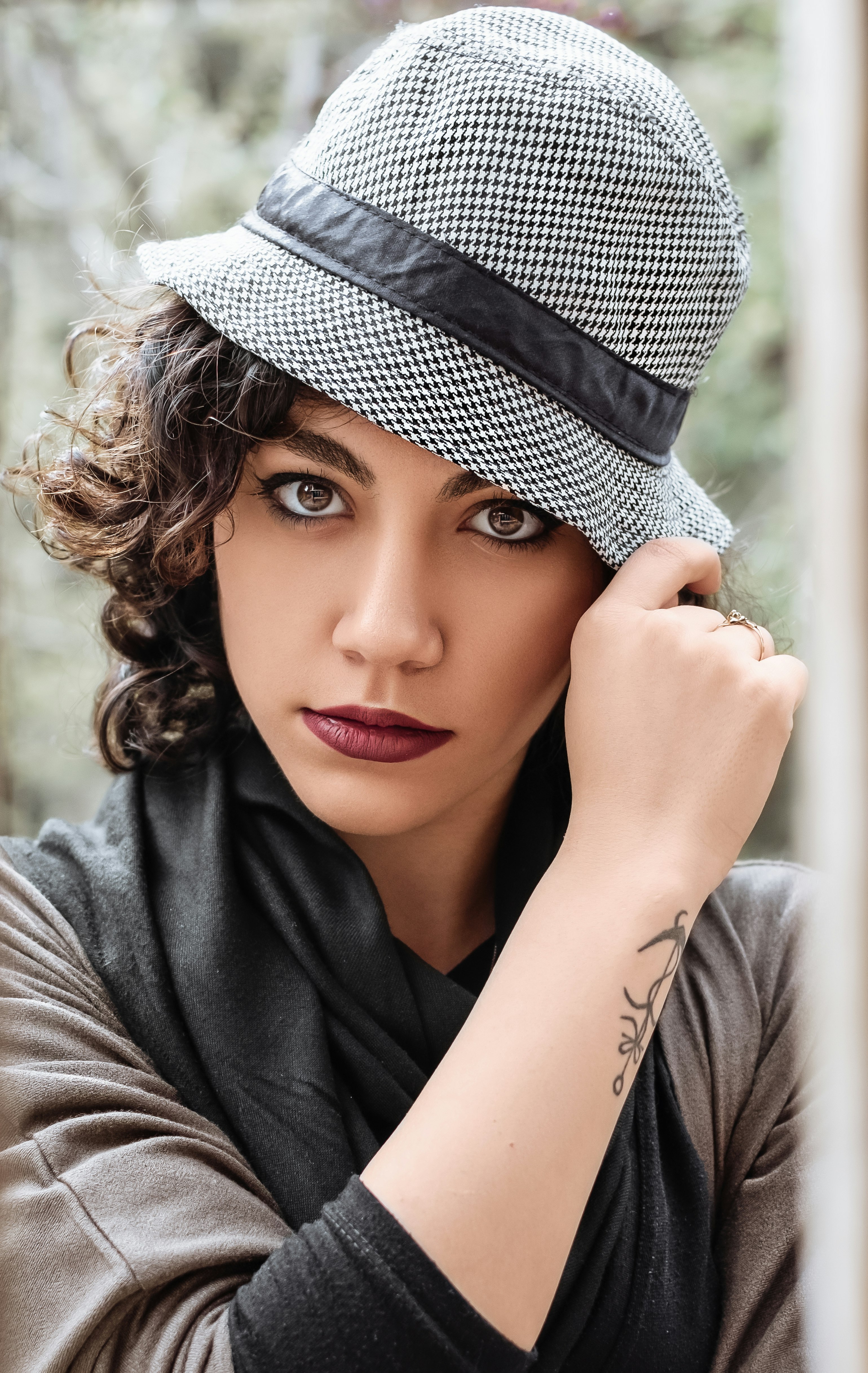 woman in gray and black hat